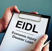 a clipboard labeled 'EIDL - Economic Injury Disaster Loan,' symbolizing the importance of disaster loans in helping businesses recover and rebuild after major disruptions.